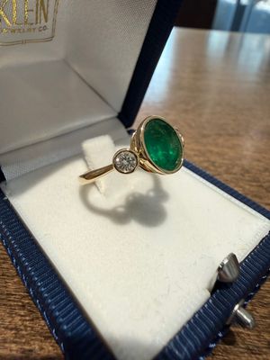14k Yellow Gold Ring Bezel set Oval Shape Emerald and Diamond Ring: Dia .27ctw Em 1.4ctq