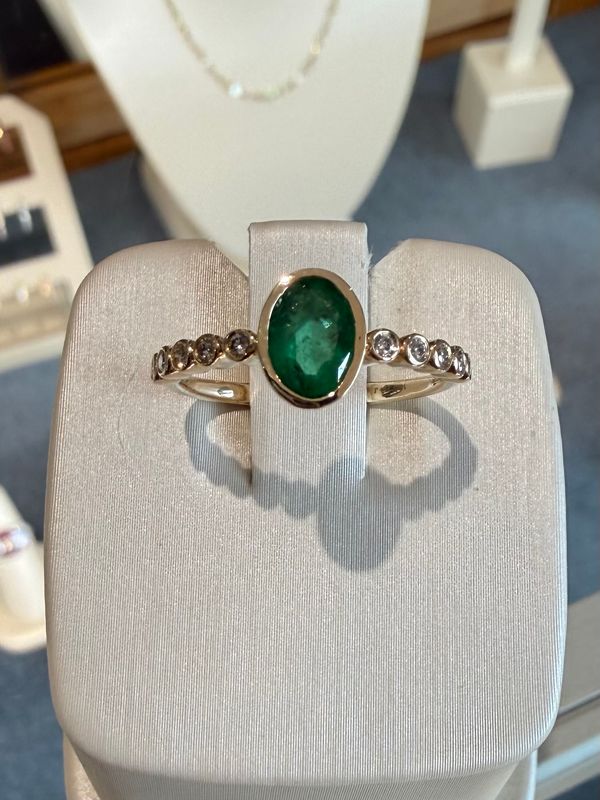 14k Yellow Gold Ring Bezel Set Oval Shape Emerald .60ct and Diamond Accents .12ctw