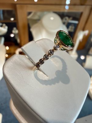 14k Yellow Gold Ring Bezel Set Oval Shape Emerald .60ct and Diamond Accents .12ctw