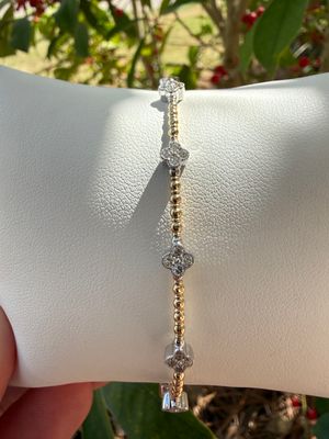 14k Yellow Gold Flex Bangle with 7 Diamond Clover Stations .47ctw