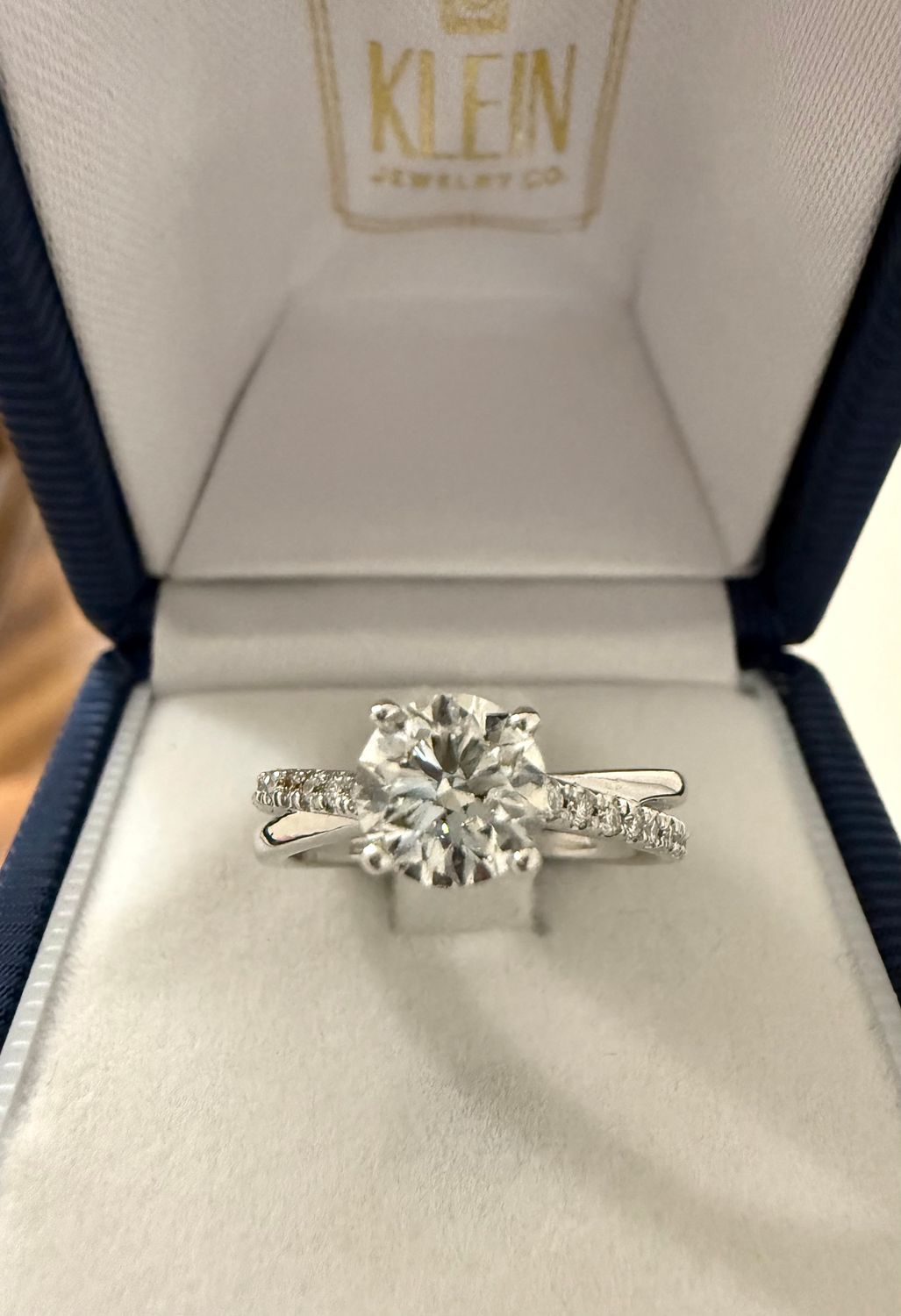 14k White Gold .90 ct GIA I VS2 Round Diamond Solitare Engagement Ring with Interlocking Shank with Diamond Accents.  1.10ctw