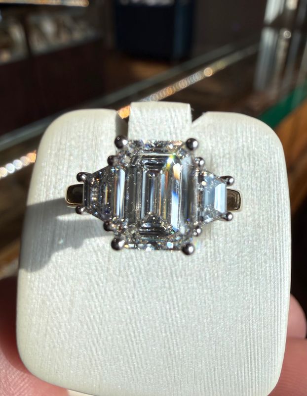 14k Yellow and White Gold Three Stone 2.10ct E VVS2 Center Emerld Cut Lab Grown Diamond Engagement Ring with Trapazoid Cut Sides .53ct Ring total Lab Dia 2.63ctw