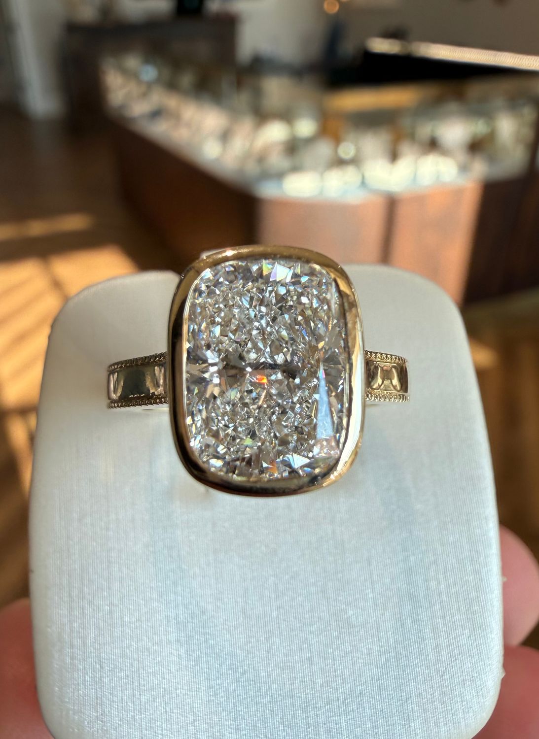 14k Yellow Gold Bezel-Set Wide-Band 3.10 E VVS2 Elongated Cushion Lab Diamond Engagement Ring With Diamond-Edged Shank