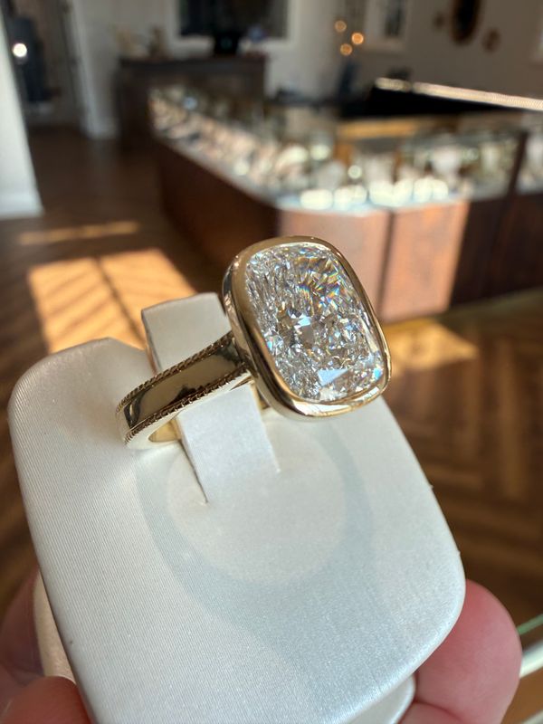 14k Yellow Gold Bezel-Set Wide-Band 3.10 E VVS2 Elongated Cushion Lab Diamond Engagement Ring With Diamond-Edged Shank