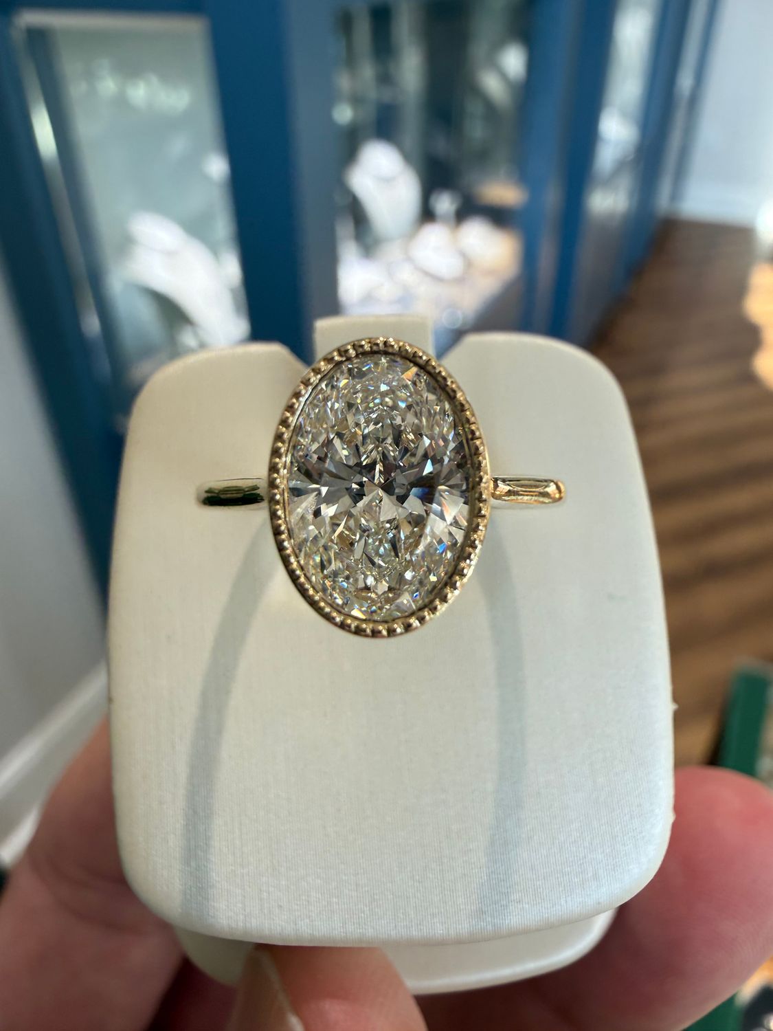 14k Yellow Gold 2.07ct Oval Lab Grown Diamond Bezel Set Solitaire Engagement Ring with Milgrain Accents on the Bezel