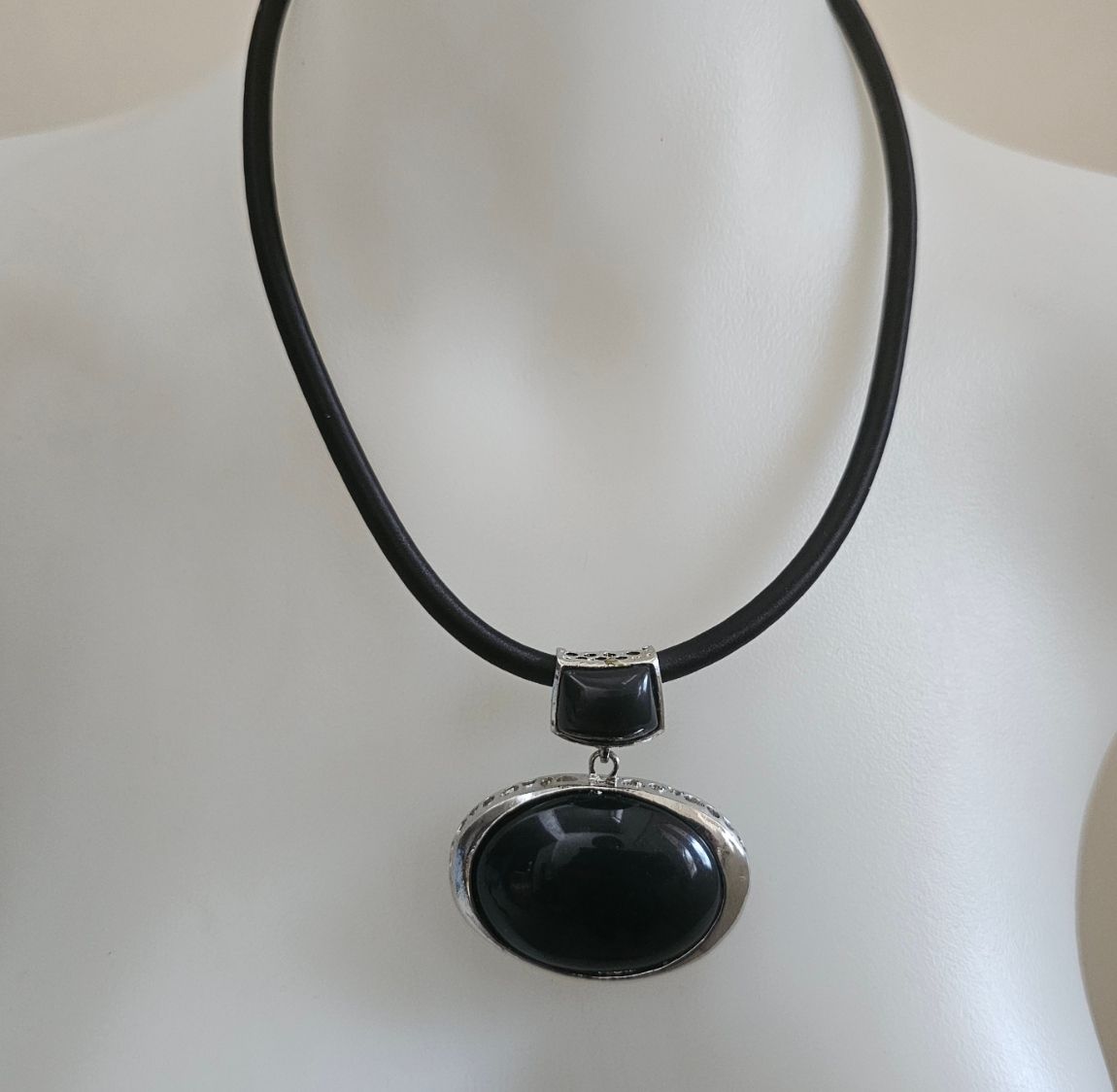 Sleek black acrylic pendant necklace with a modern, bold charm