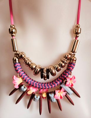 Vibrant flair in a necklace - floral accents and bold texture