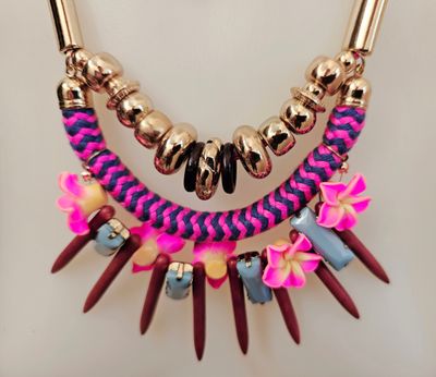 Vibrant flair in a necklace - floral accents and bold texture