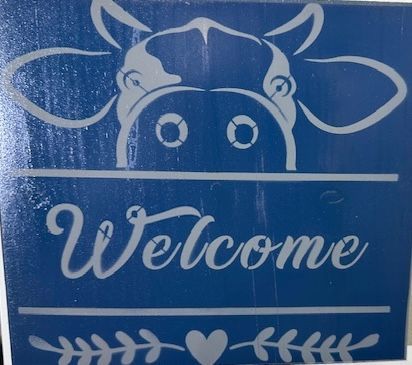 Blue Cow Welcome Sign