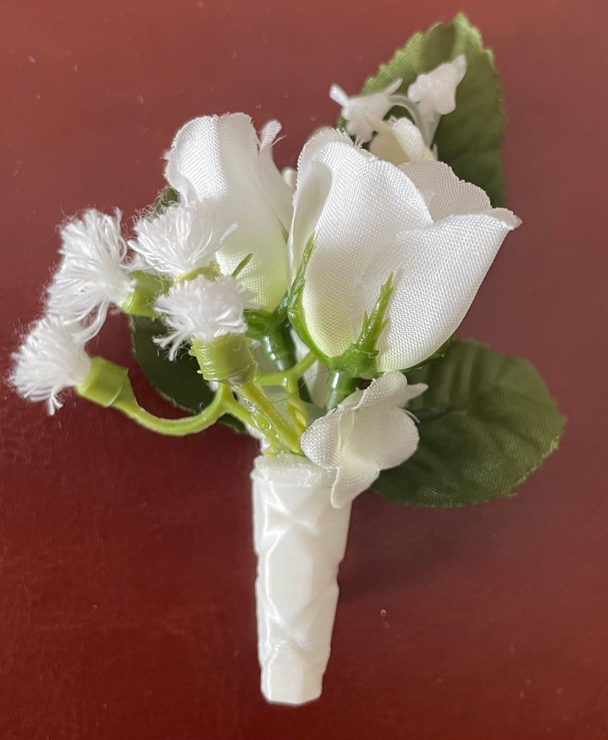 White Silk and Cream Boutonnière with Baby&#39;s Breath and Greenery