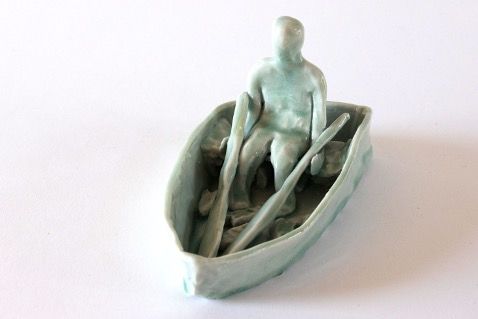 Joy in Pottery | Man in boat rowing