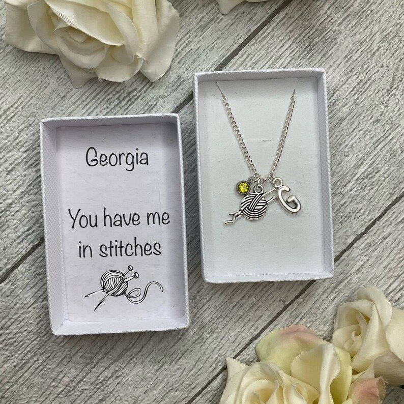 Knitting necklace with a wool and needles charm, birthstone and initial charms