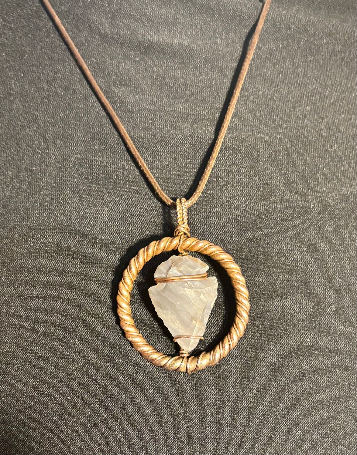 Handcrafted Copper-Wrapped Agate Arrowhead within Tensor Ring - Length: 1.93in | Width: 1.44in