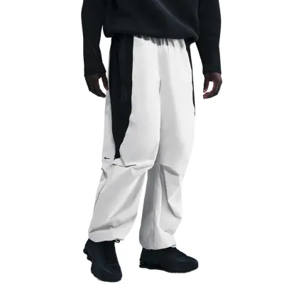 NIKE TECH WOVEN DRI-FIT COLOR-BLOCK OVERSIZED PANT