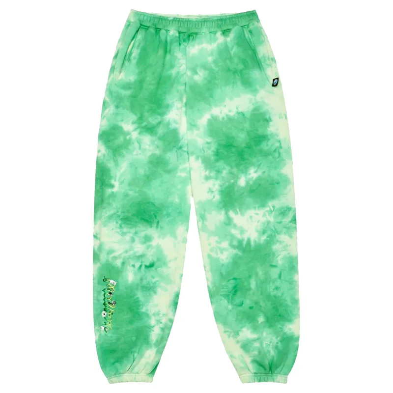 Front view of Malbon Grateful Dead Clubhouse Sweatpants in green tie dye with green printed artwork on right leg.
