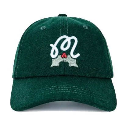 Front view of Malbon Golf Mistleflow Dad Hat in hunter green with embroidered M script holly logo.