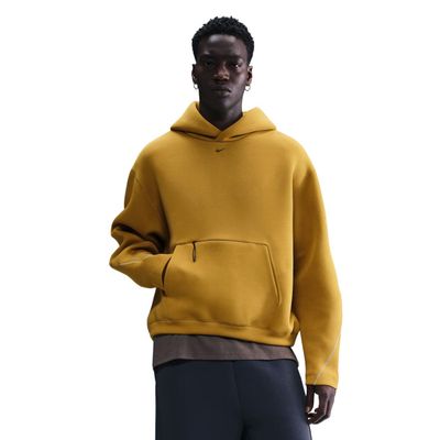 Front view of Nike Tech Fleece oversized pullover hoodie in ochre and black with pouch pocket and embroidered swoosh.