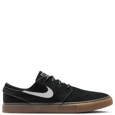 Side view of Nike SB Zoom Janoski OG+ skate shoe in black suede with white Swoosh and gum outsole.