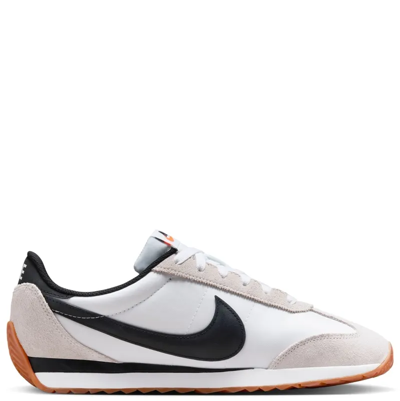 Lateral side view of Nike Pacific White Black sneaker featuring puffy black Swoosh and low-profile midsole.