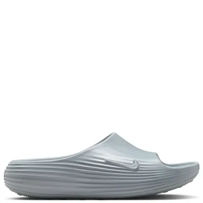 Lateral side view of Nike ReactX Rejuven8 Slide in Wolf Grey with ribbed midsole texture and molded Swoosh.