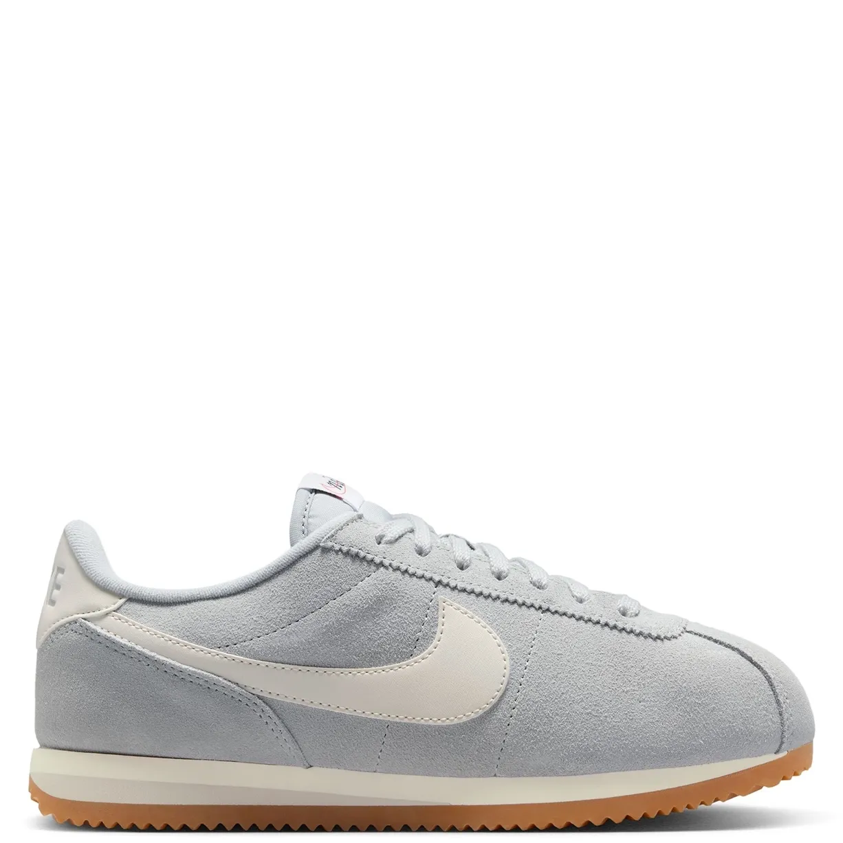 Lateral side view of Nike Women’s Cortez featuring Sail leather Swoosh and retro low-profile silhouette.
