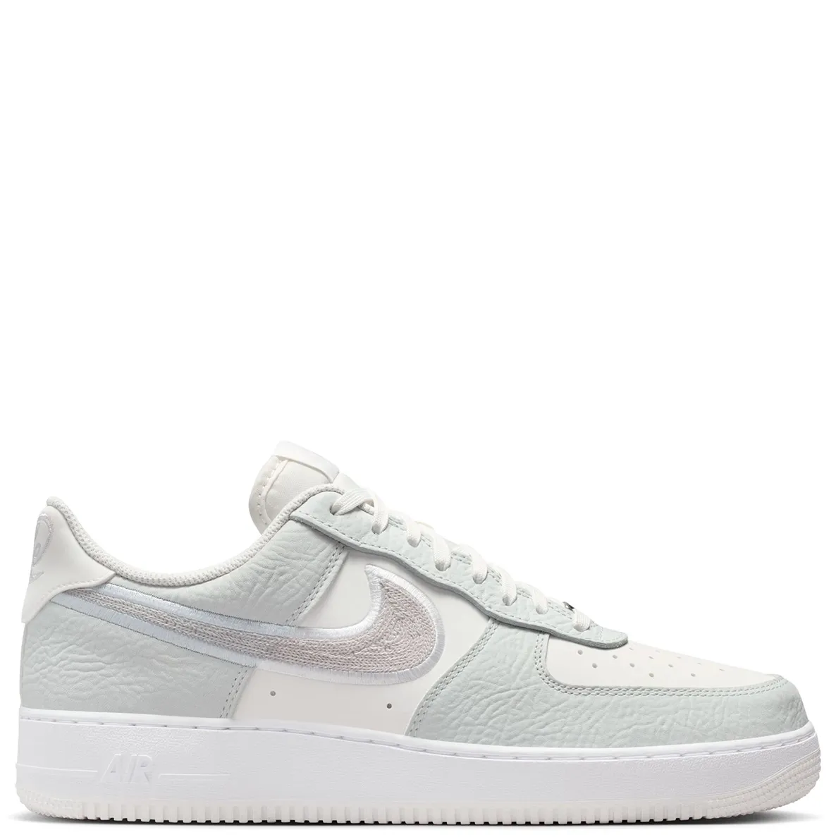 Lateral side view of Nike Air Force 1 ’07 LV8 with chain-stitched Nike Swoosh and classic cupsole.