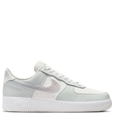 Lateral side view of Nike Air Force 1 ’07 LV8 with chain-stitched Nike Swoosh and classic cupsole.