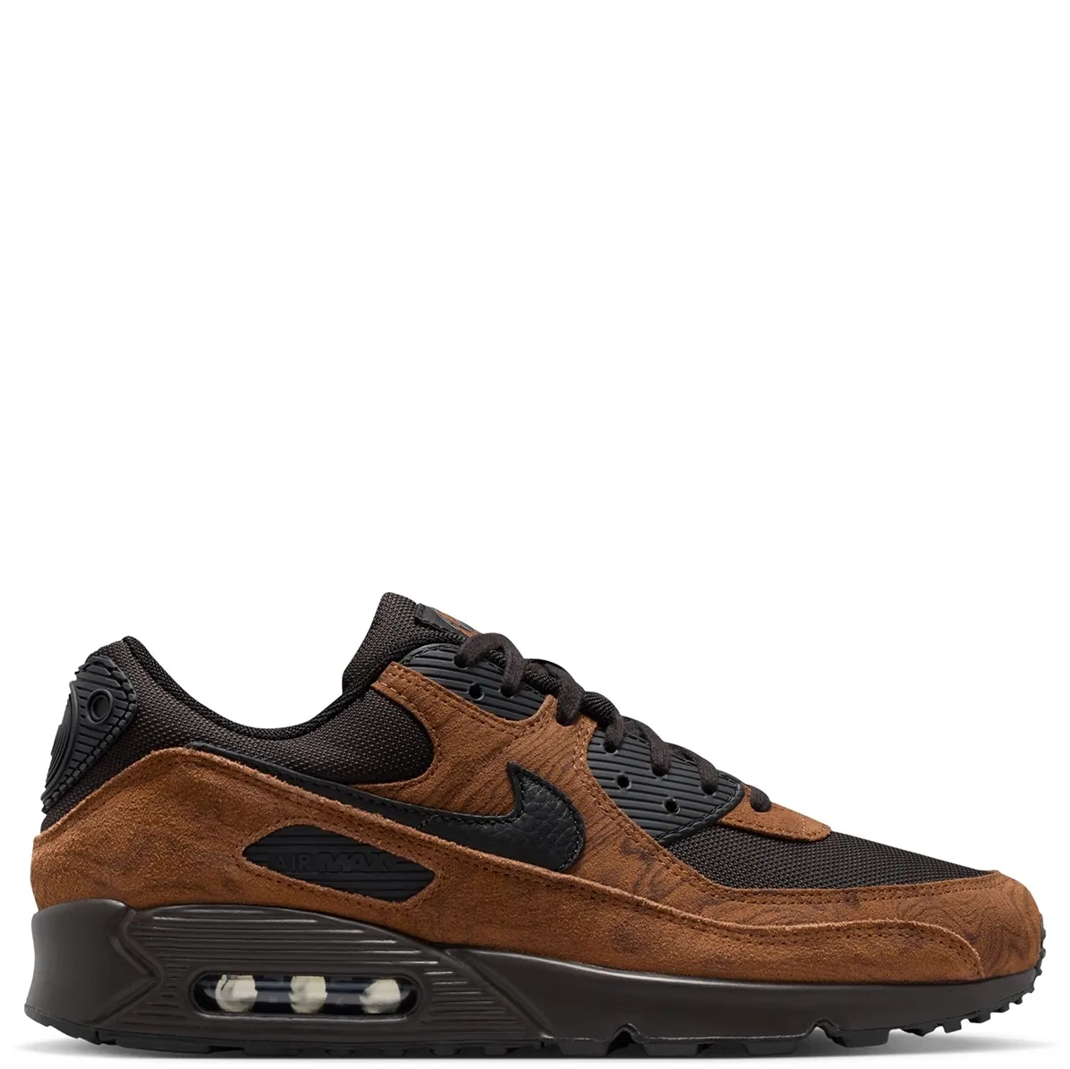Lateral side view of Nike Air Max 90 Premium featuring black Swoosh, tan suede mudguard, and visible Air unit.