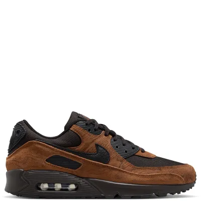 Lateral side view of Nike Air Max 90 Premium featuring black Swoosh, tan suede mudguard, and visible Air unit.