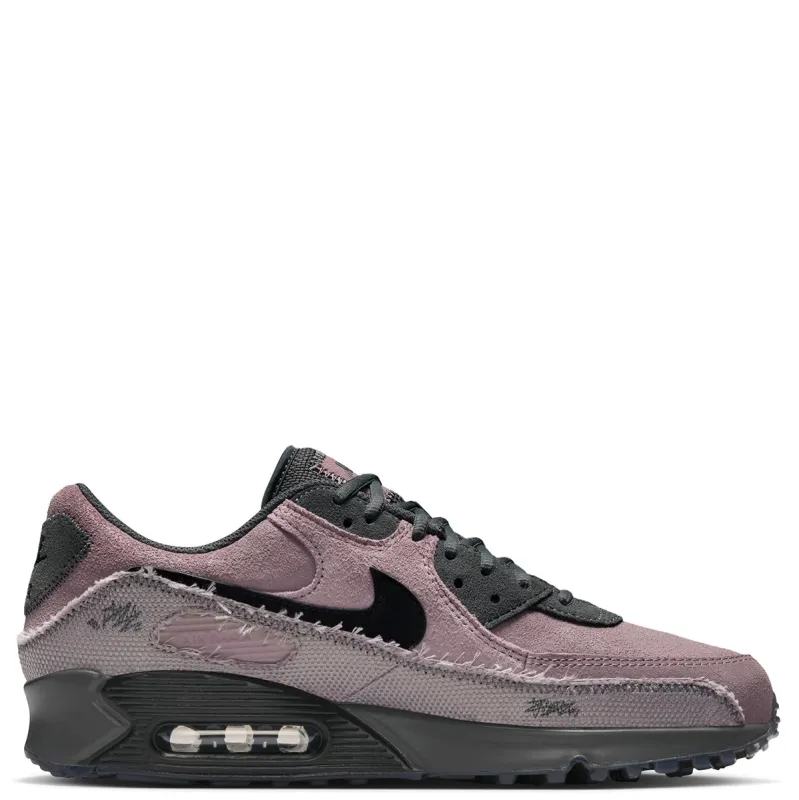 Lateral side view of Nike Air Max 90 Premium with textured panels and visible Air cushioning.
