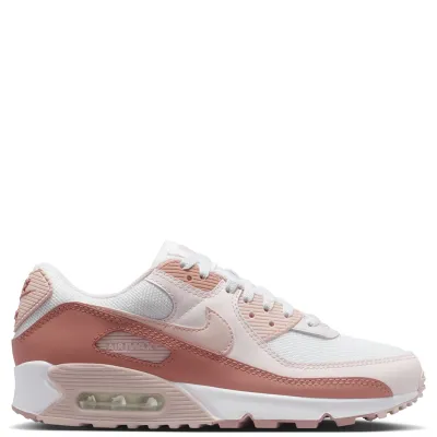 Lateral side view of Nike Air Max 90 Particle Pink with stitched overlays and visible Air cushioning.
