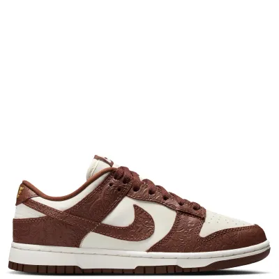 Lateral side view of Nike Dunk Low featuring Fauna Brown textured overlays and Sail leather panels.