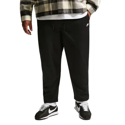 Front view of Nike Club Woven Taper Pant in black showing tapered leg and clean silhouette