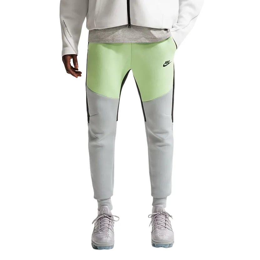Front view of Nike Tech Fleece Jogger in liquid lime and grey with tapered leg design