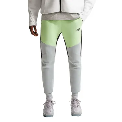 Front view of Nike Tech Fleece Jogger in liquid lime and grey with tapered leg design