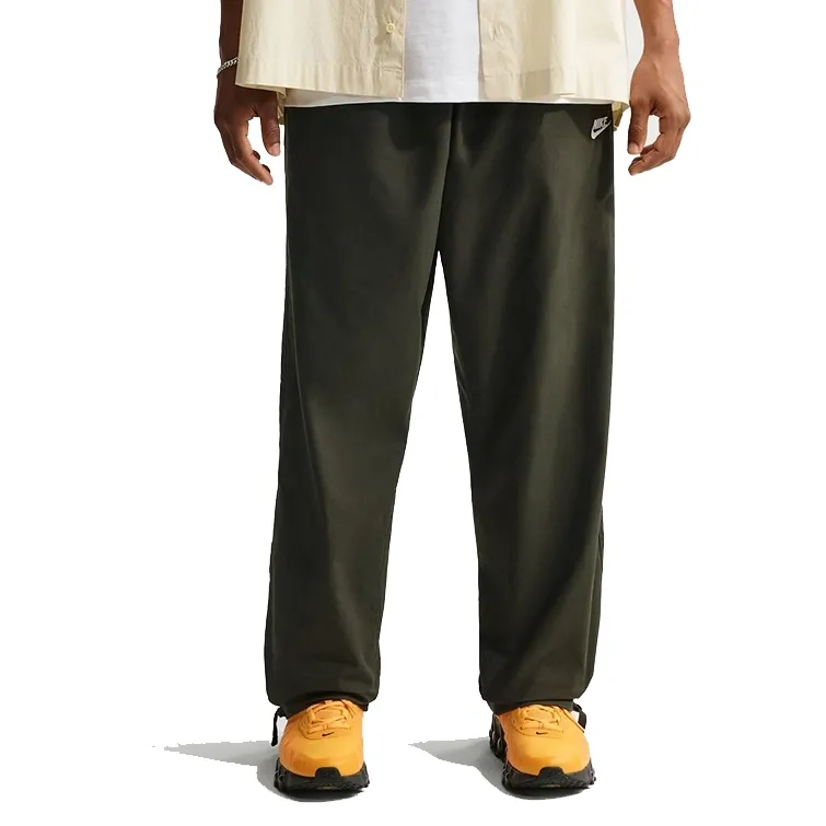 Front view of Nike Club Barcelona Pant in Sequoia showing relaxed fit and straight leg silhouette