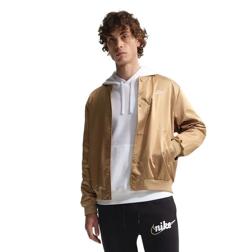 Hooded layering detail under varsity jacket