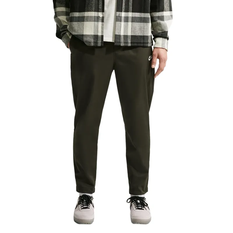 Close-up of tapered leg opening on Nike woven pants