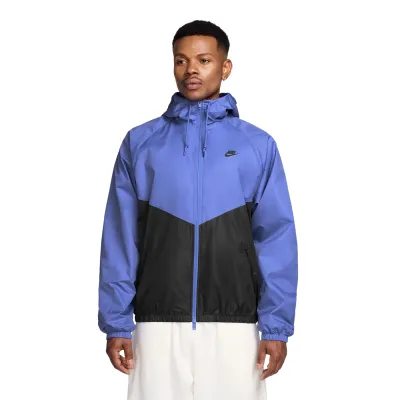 Front view of Nike Windrunner Lined Jacket in sapphire and black with chevron panel design