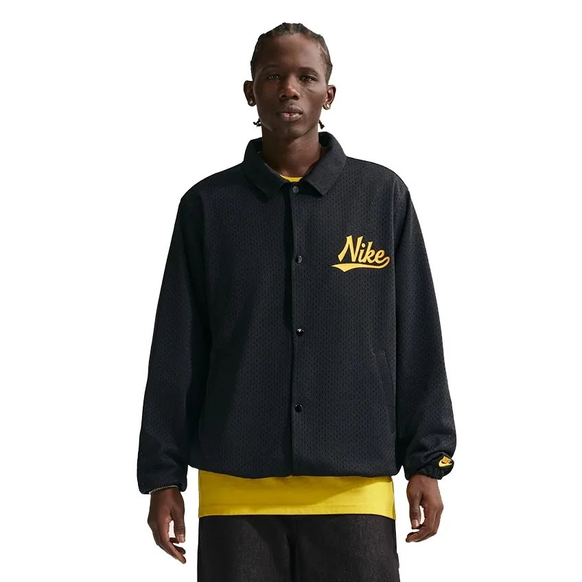 Front view of Nike Club Coaches Jacket with snap-button closure and Nike script logo