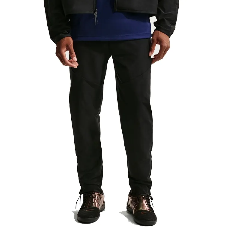 Front view of Nike Tech Dri-FIT Shori Pants in black highlighting the relaxed fit and clean Tech silhouette