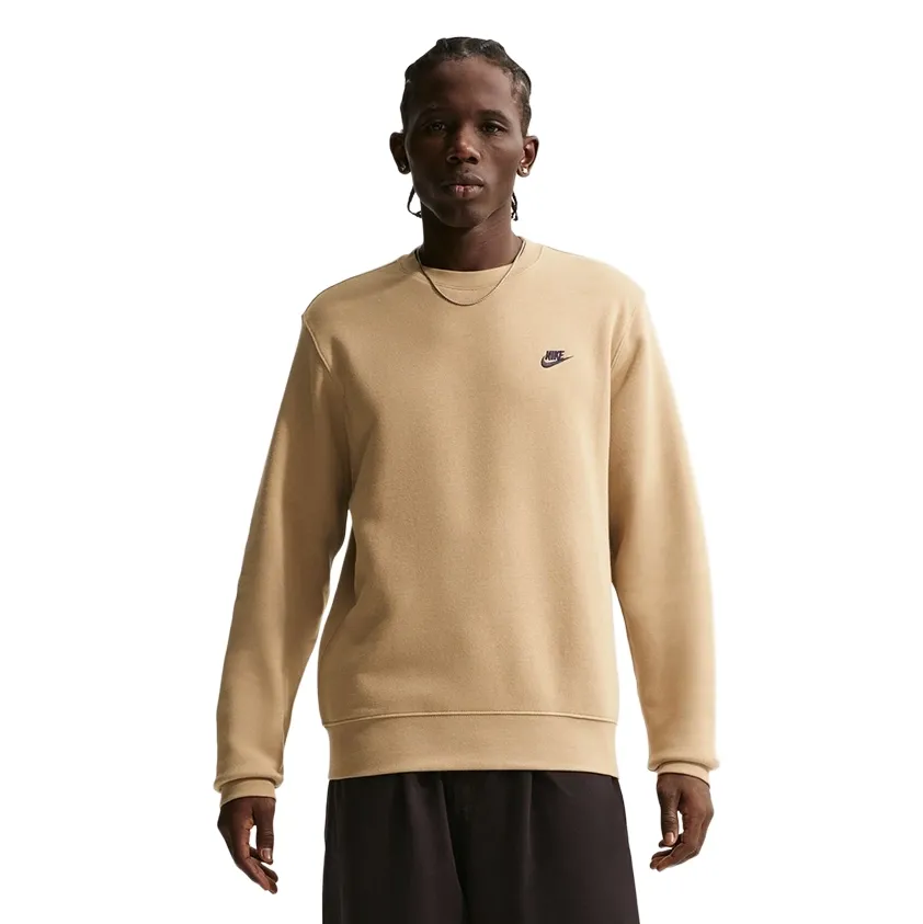 Front view of Nike Club Crewneck Sweatshirt in Parachute Beige featuring classic crew silhouette and embroidered Nike Futura 