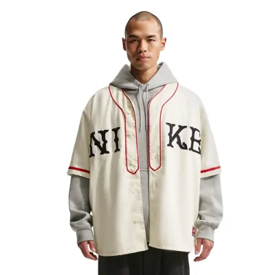 Front view displaying felt NIKE letter patches and button-front design
