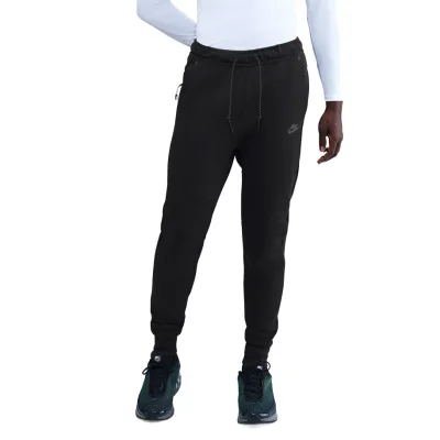 Front view of black Nike Tech Fleece joggers showing slim fit, elastic waistband, and drawcord