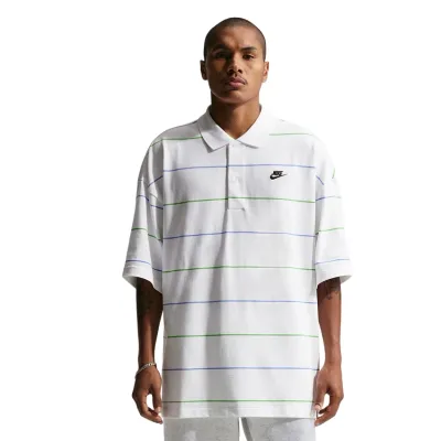 Front view of white striped Nike oversized polo with ribbed collar and embroidered chest logo