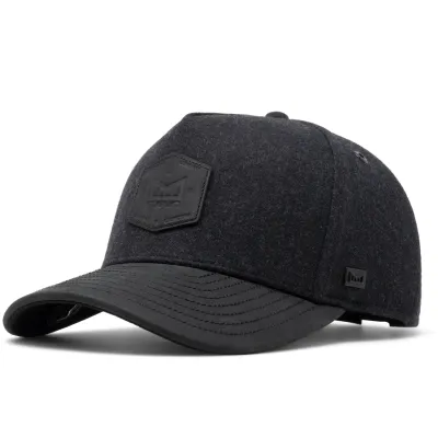Angled front view of Melin Odysea Scout Thermal black cap with leather visor
