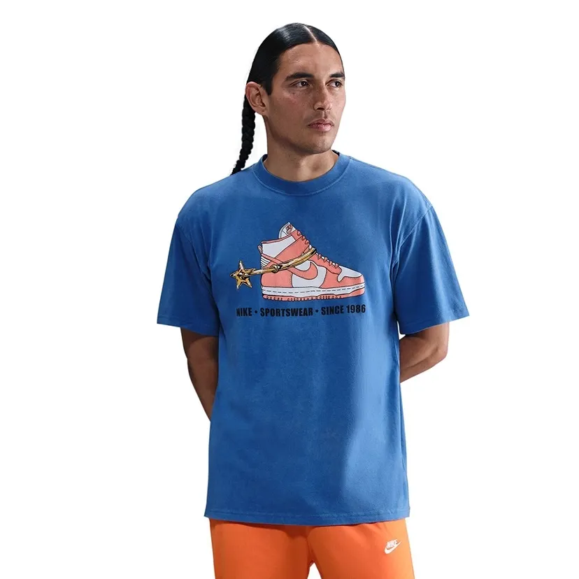 Front view of blue Nike T-shirt with sneaker graphic and “Nike Sportswear Since 1986” text.