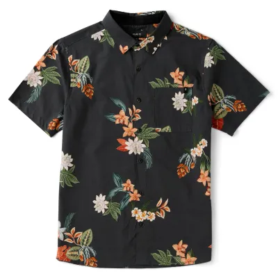 Front view of Roark Journey Shirt in Onyx black with all-over tropical floral print in orange, cream, and green.