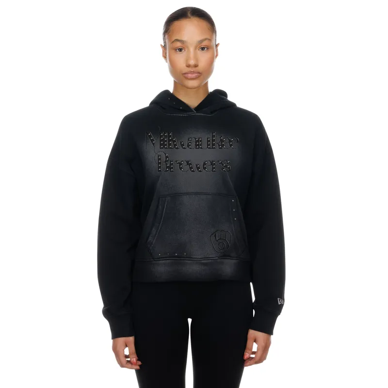 Model wearing black Brewers women’s hoodie featuring studded team script, drop shoulders, and relaxed fit.