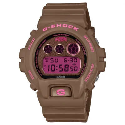 Brown G-SHOCK DW6900HH-5 Hardies NYC watch with pink digital display and triple graph detail.